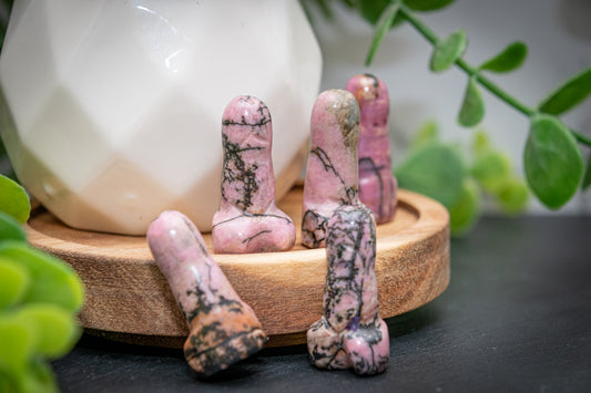 Rhodanite phallus carving